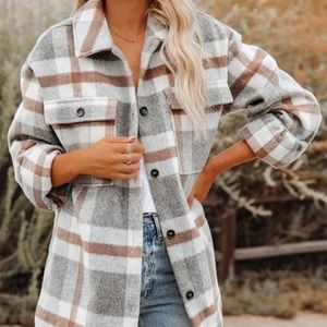 Women’s Plaid jacket with button closures. Size small.